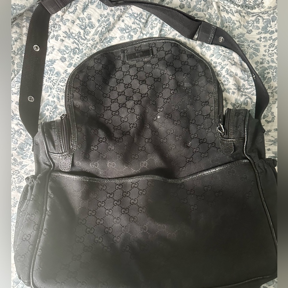 Black Gucci diaper bag. Changing pad never used